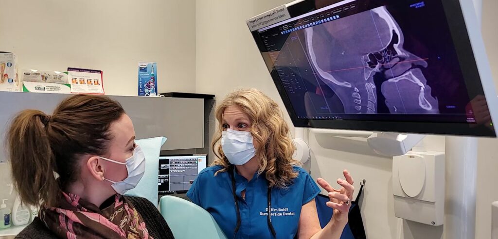 Edmonton dental implants consultation, Dr. Kim and patient